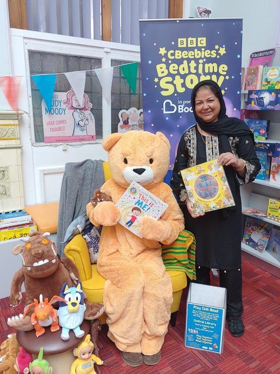 Cllr Khatun and Sandy Bear in the CBeebies Bedtime Stories Chair