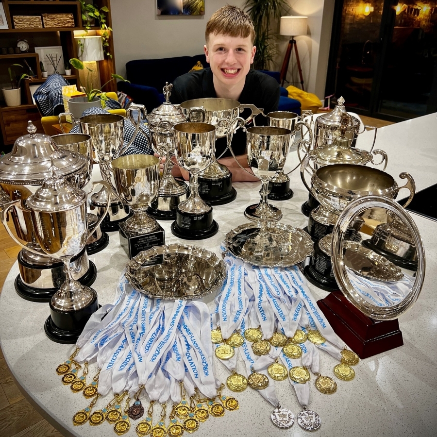 Kaiden with his medals and trophies