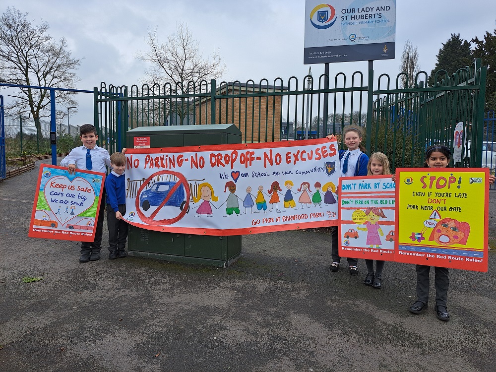 Pupils with road safety banners, left to right, Blake, Oliver, Hannah, Esme and Khushi