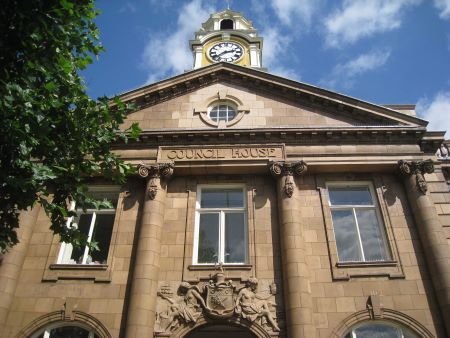 Historic stone building with a clock tower.