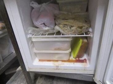 Contents of dirty fridge containing food items