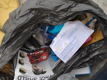 Rubbish bag containing household litter