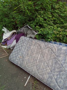 Dumped mattress in street