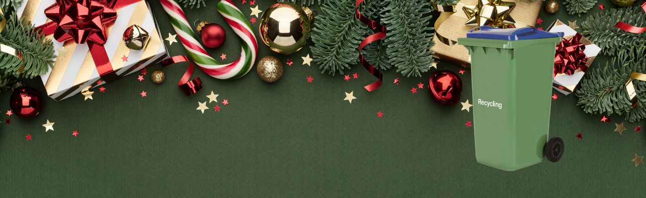 Image of christmas decorations and a green wheelie bin