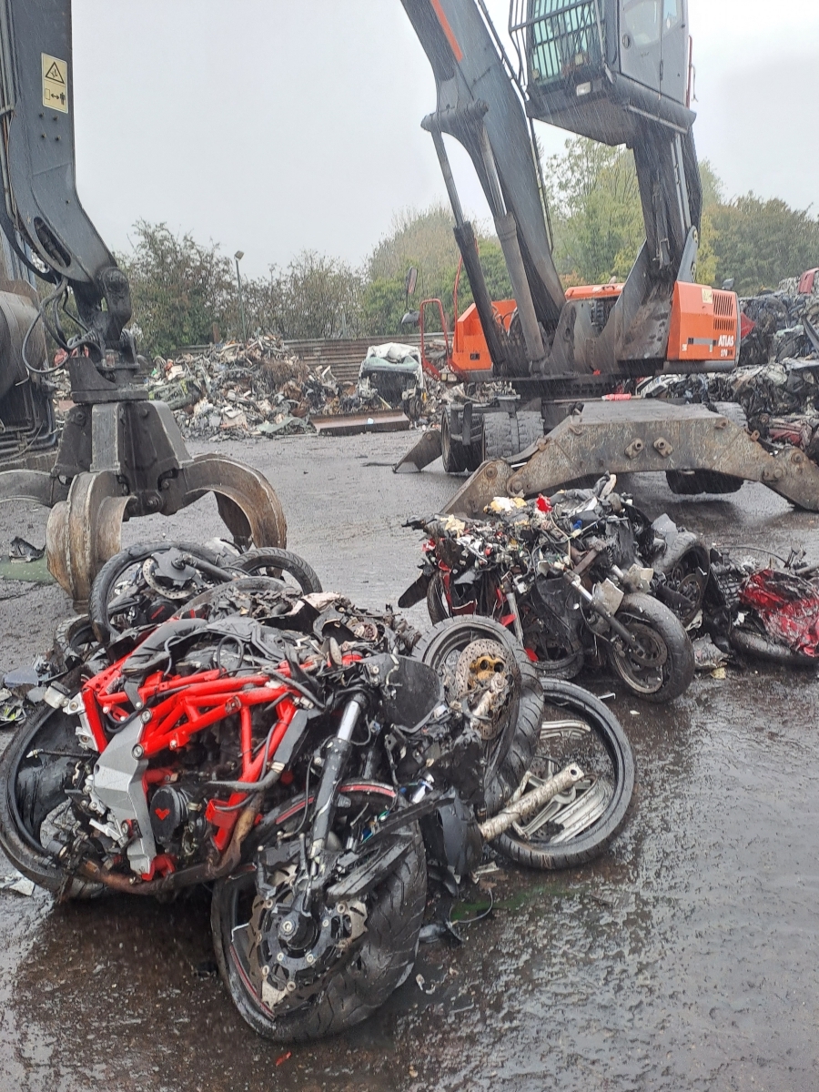 A photo of crushed off-road motorbikes