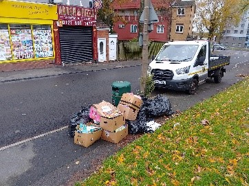 Bags and boxes dumped in the street in Messenger Road, Smethwick