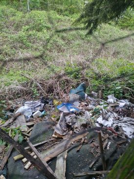 Household rubbish dumped on land