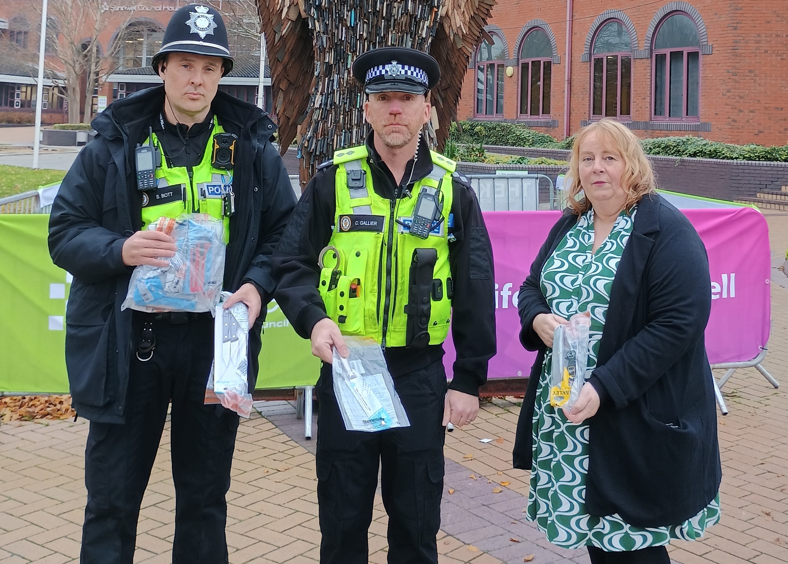 Sandwell Police's PC Stuart Bott and Inspector Colin Gallier with Councillor Suzanne Hartwell by the Knife Angel in Oldbury Civic Square