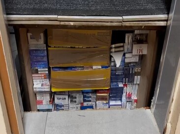 Illegal cigarettes and vaping products found in concealed compartment under toilet flooring within commercial premises